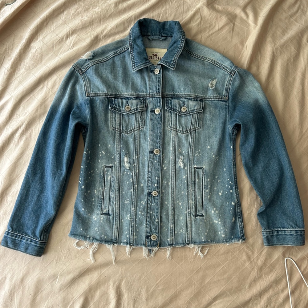 Hollister Distressed Denim Jacket size Small. Raw hem, distressed accents. Cute!